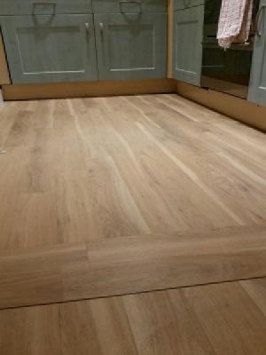 Amtico spacia eden oak with a pinstripe walnut border supplied by carpet style watfords only premium supplier with approved installers