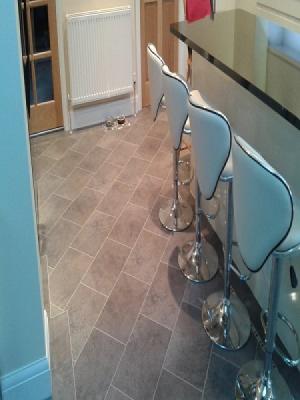 karndeans knight tiles cumbrian stone supplied and fitted by approved installers. design strips and mosiac border with tiles laid on the 45°