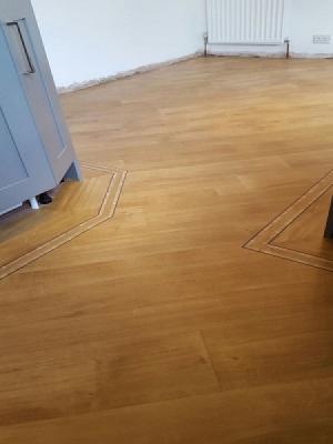 amtico signature laid on the 45° woith a metro border supplied and installed by carpetstyle watford