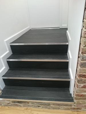 Amtico spacia ebony installed on stairs with gradus stair nosings