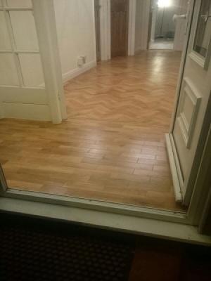 Karndean supplied and installed by registered fitters. art select blonde oak parquet herringbone design with a tram line border hallway and porch.