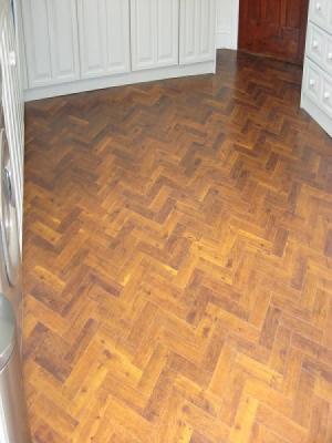 Amtico signature supplied and installed in gerrards cross using approved installers. priory oak laid in a herringbone pattern