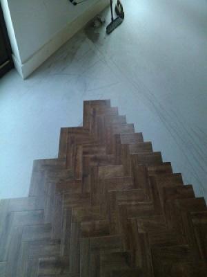Amtico signature farmhouse oak laid in a parquet design. supplied by Watfords only premium retailer with approved fitters.
