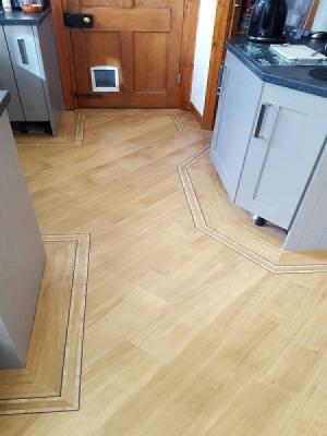 amtico golden oak signature laid on the 45° with a metro border supplied by carpet style and installed by our amtico approved installers