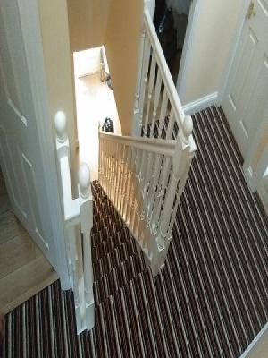 carpet style supplied and fitted this stairs landing stripe carpet in oxhey